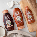 Garnier Whole Blends Sustainably Sourced Coconut Oil and Cocoa Butter Leave in Conditioner Treatment to Smooth and Control Frizzy Hair, 5.1 Fl Oz Garnier